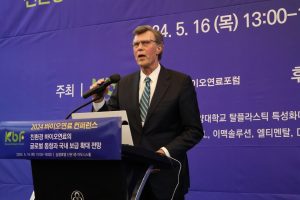 A man speaking at a podium