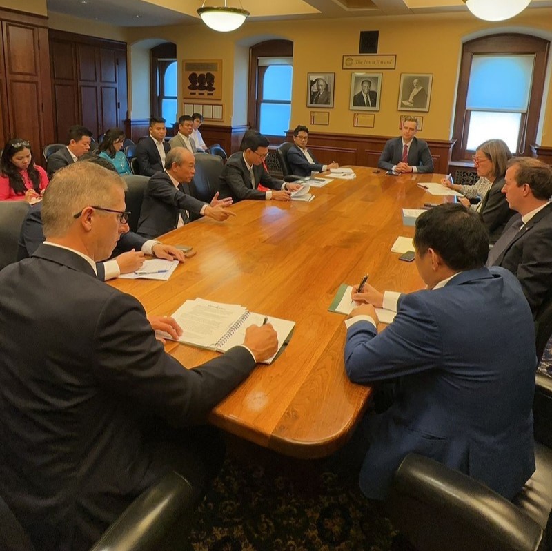 A group of people meeting around a table