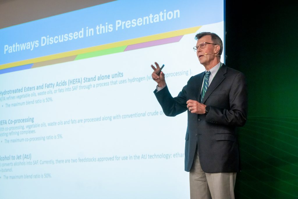 A man giving a slideshow presentation