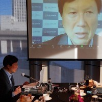 image of man presenting at conference